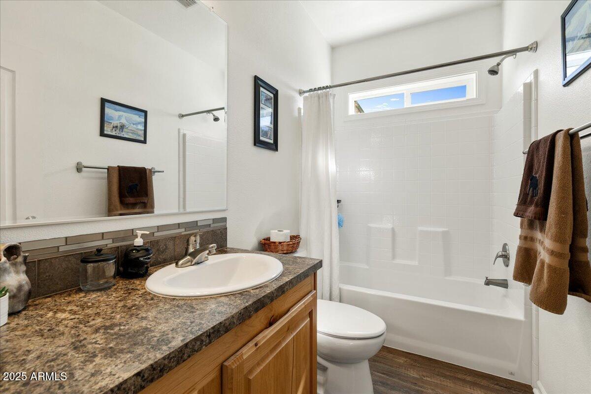 3107 West Country Quail Trail Paulden, AZ 86334 - Photo 20 of 46 a bathroom with a granite countertop sink toilet and shower