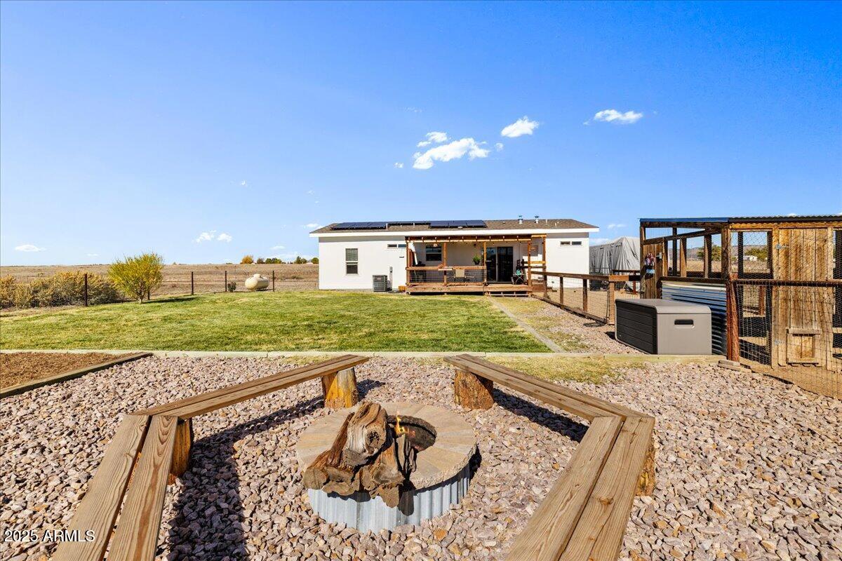 3107 West Country Quail Trail Paulden, AZ 86334 - Photo 30 of 47 a view of a house with a backyard and a patio