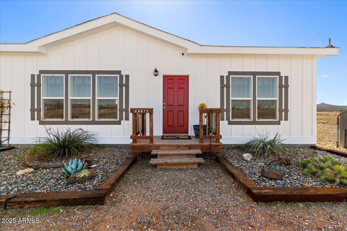 3107 West Country Quail Trail Paulden, AZ 86334 - Photo 5 of 46 a front view of a house with a yard
