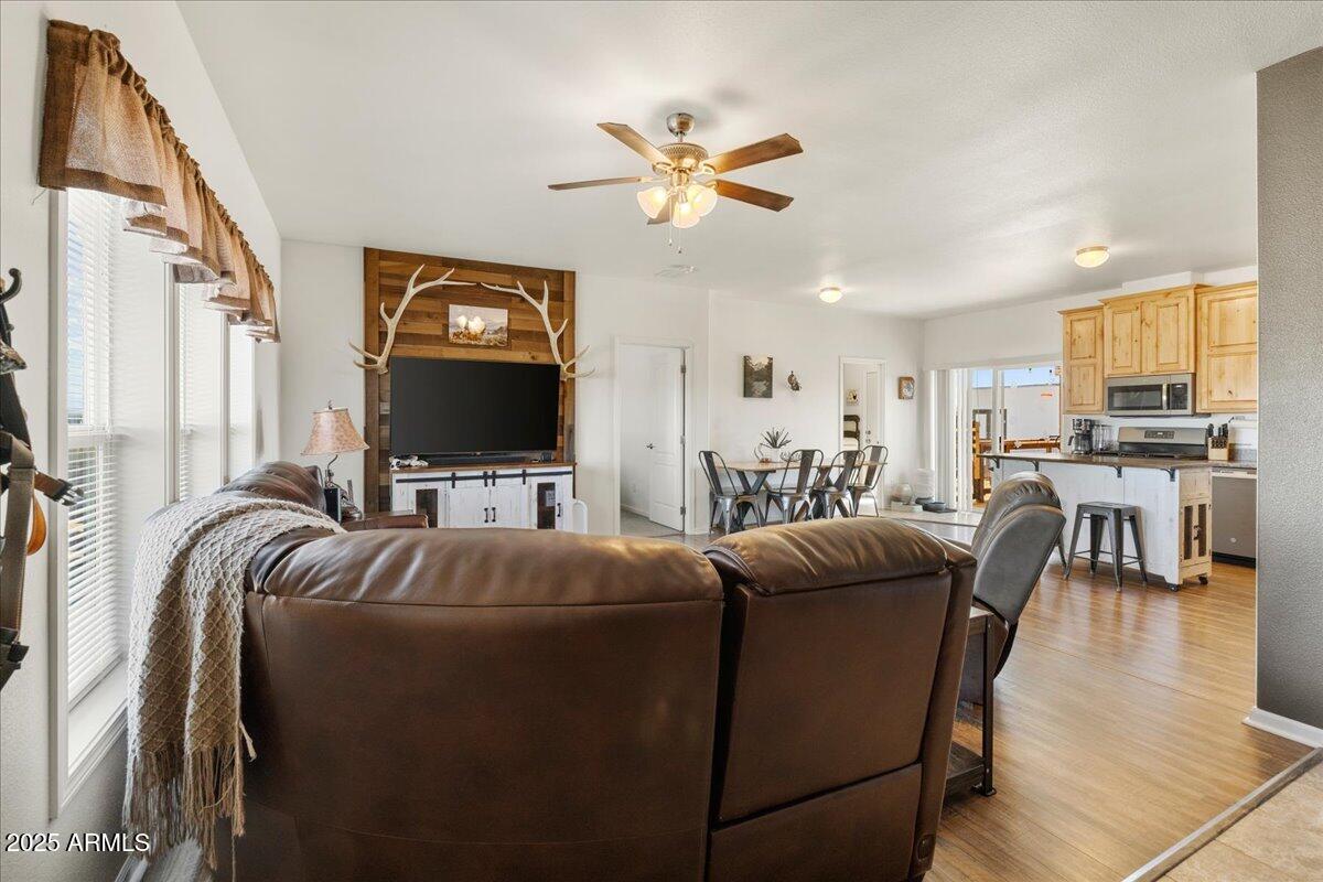 3107 West Country Quail Trail Paulden, AZ 86334 - Photo 6 of 46 a living room with furniture and a flat screen tv