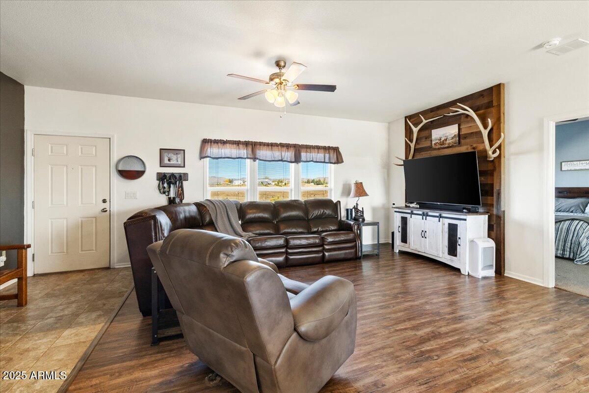 3107 West Country Quail Trail Paulden, AZ 86334 - Photo 7 of 46 a living room with furniture and a flat screen tv