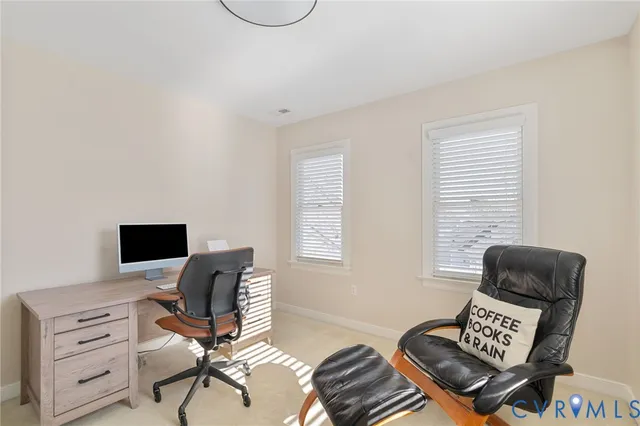 a view of workspace with wooden floor windows