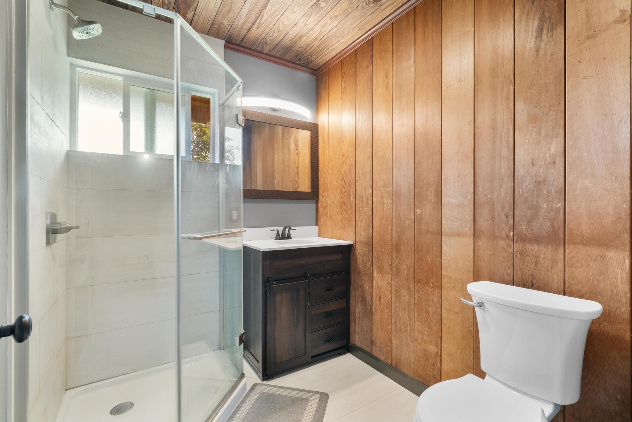 89-811 Huanui Road Captain Cook, HI 96704 - Photo 13 of 30 a bathroom with a sink and mirror