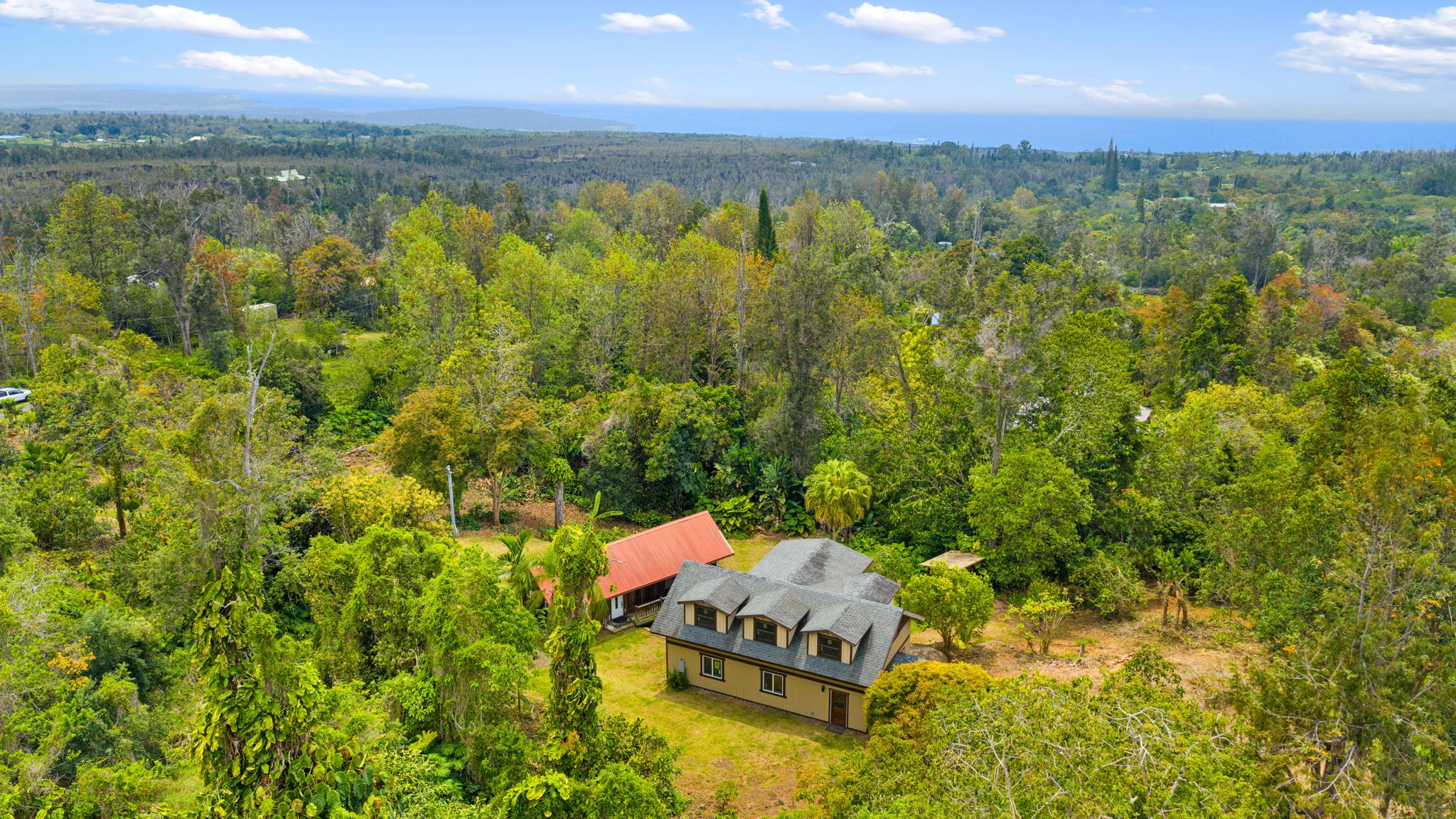 89-811 Huanui Road Captain Cook, HI 96704 - Photo 2 of 30 a aerial view of a house with a yard and lake view