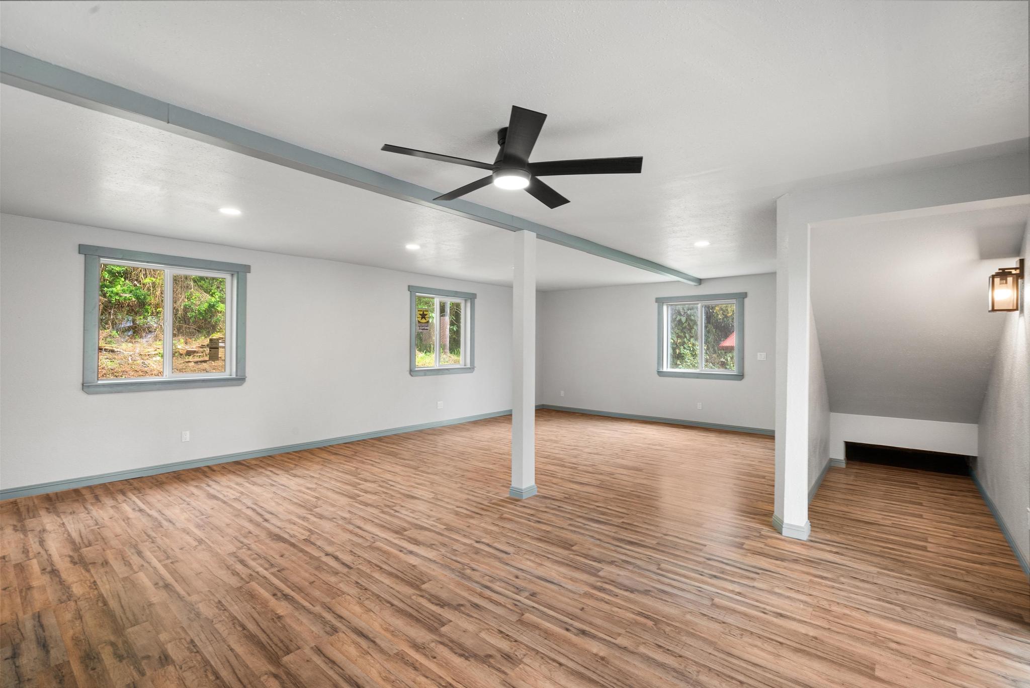 89-811 Huanui Road Captain Cook, HI 96704 - Photo 21 of 30 a view of an empty room with a window and wooden floor