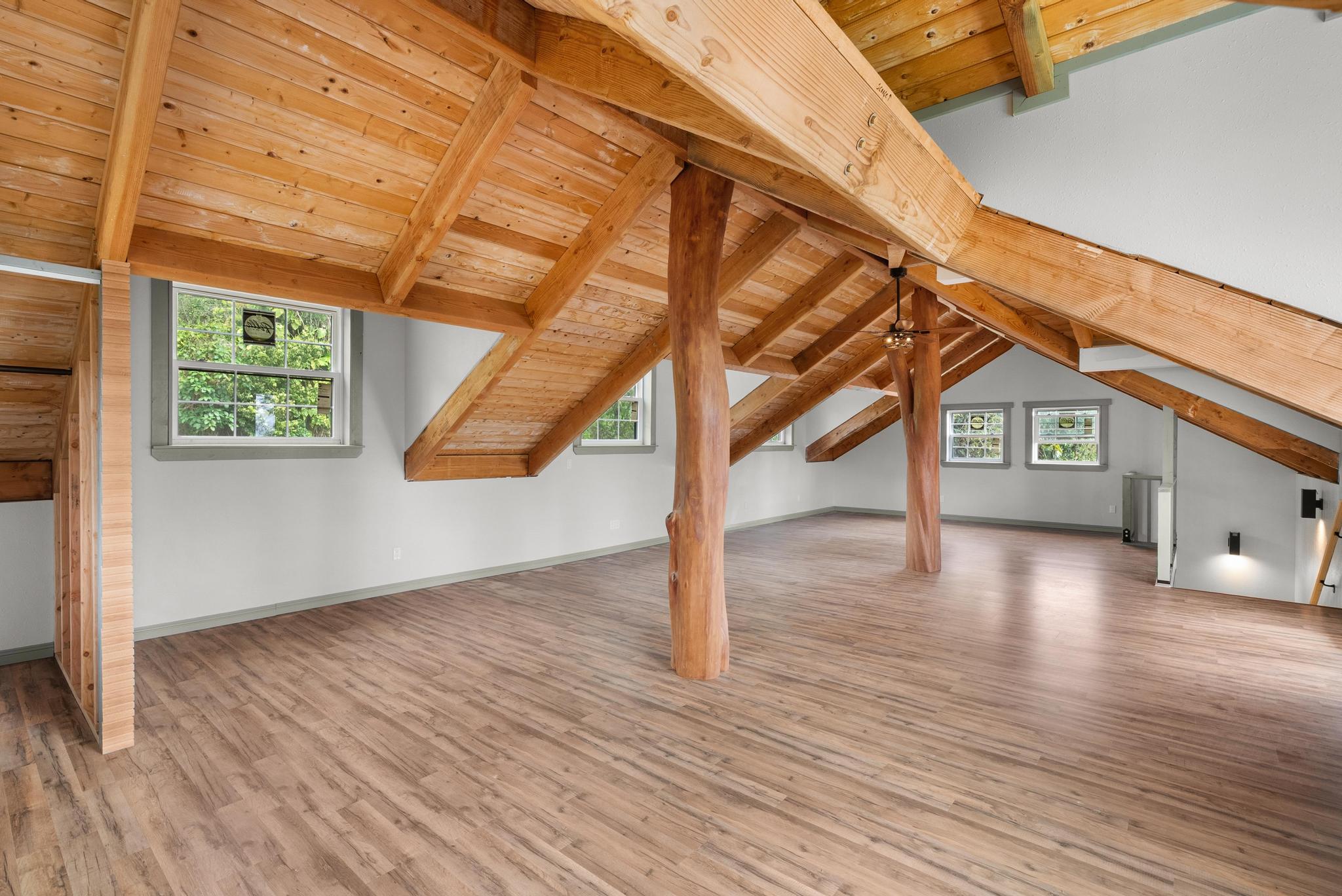 89-811 Huanui Road Captain Cook, HI 96704 - Photo 27 of 30 a view of a room with wooden floor and windows