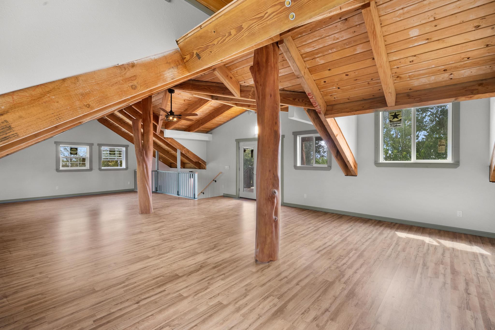 89-811 Huanui Road Captain Cook, HI 96704 - Photo 28 of 30 a view of a house with a big yard and wooden floor