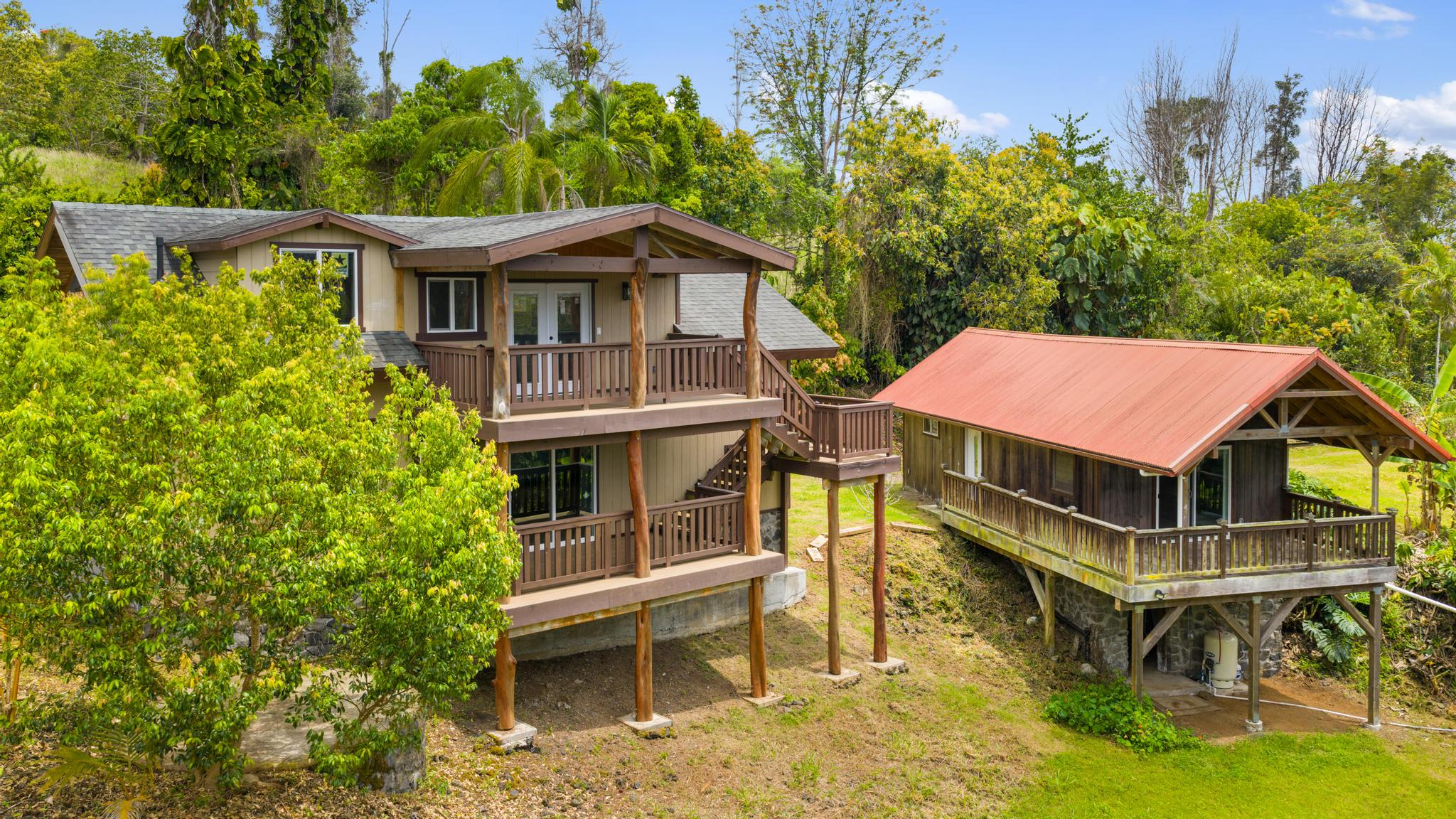 89-811 Huanui Road Captain Cook, HI 96704 - Photo 4 of 30 an aerial view of a house with a yard table and chairs