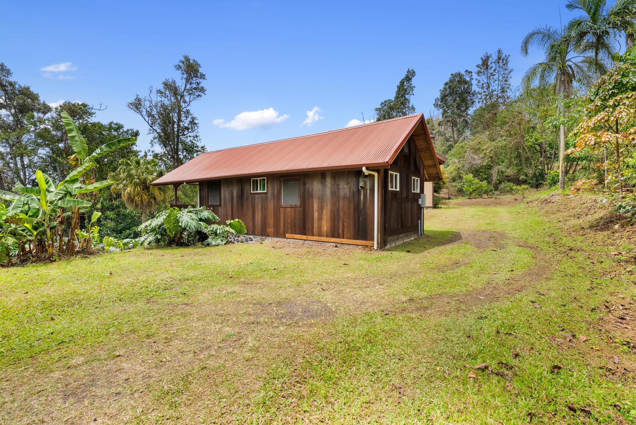 89-811 Huanui Road Captain Cook, HI 96704 - Photo 10 of 30 a view of a house with pool and a yard