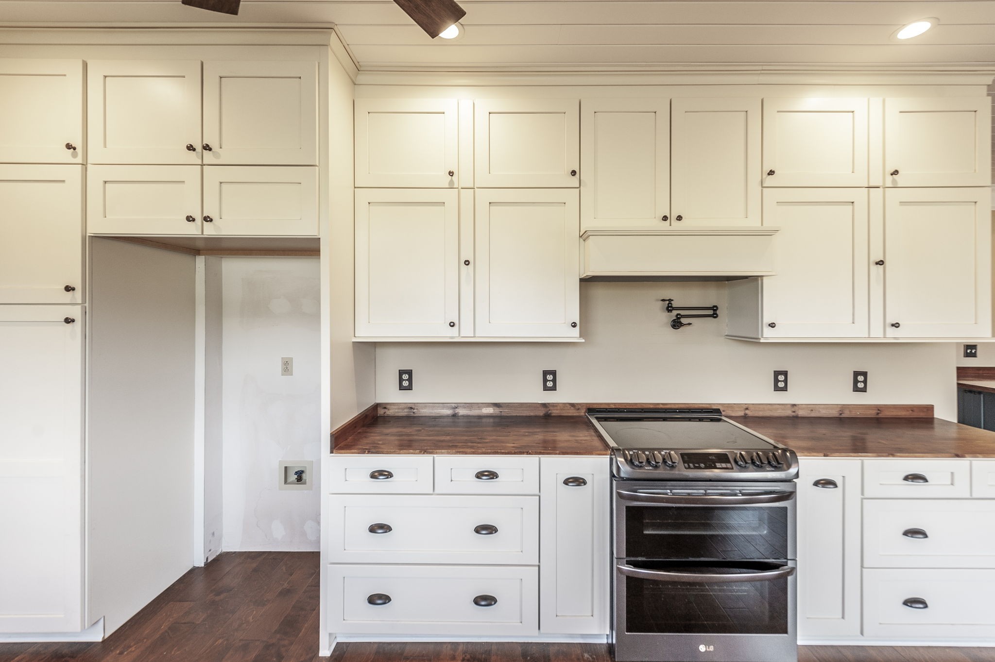 724 Deshea Creek Road Gallatin, TN 37066 - Photo 33 of 76 a kitchen with white cabinets and white appliances