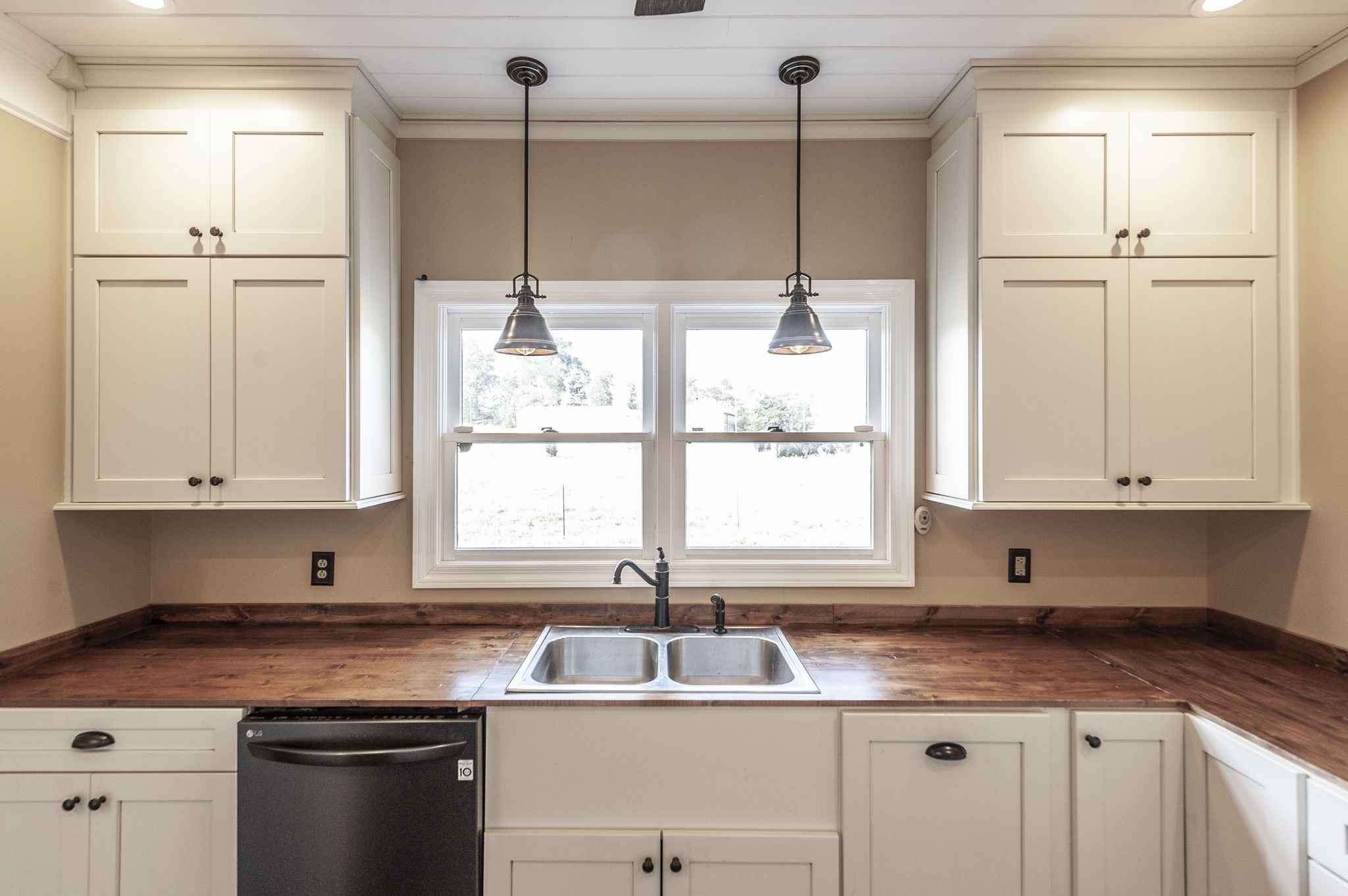 724 Deshea Creek Road Gallatin, TN 37066 - Photo 34 of 76 a kitchen with stainless steel appliances granite countertop a sink window and cabinets
