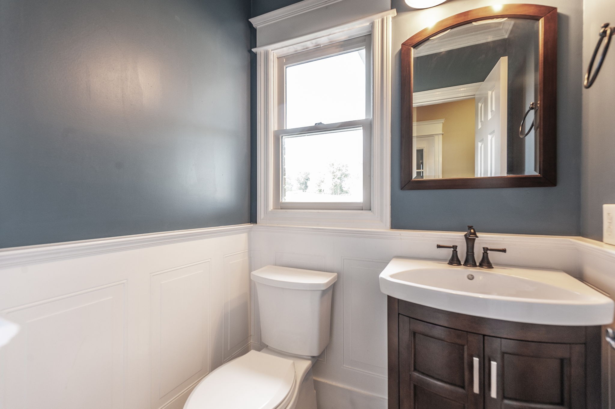 724 Deshea Creek Road Gallatin, TN 37066 - Photo 38 of 76 a bathroom with a toilet a sink and mirror