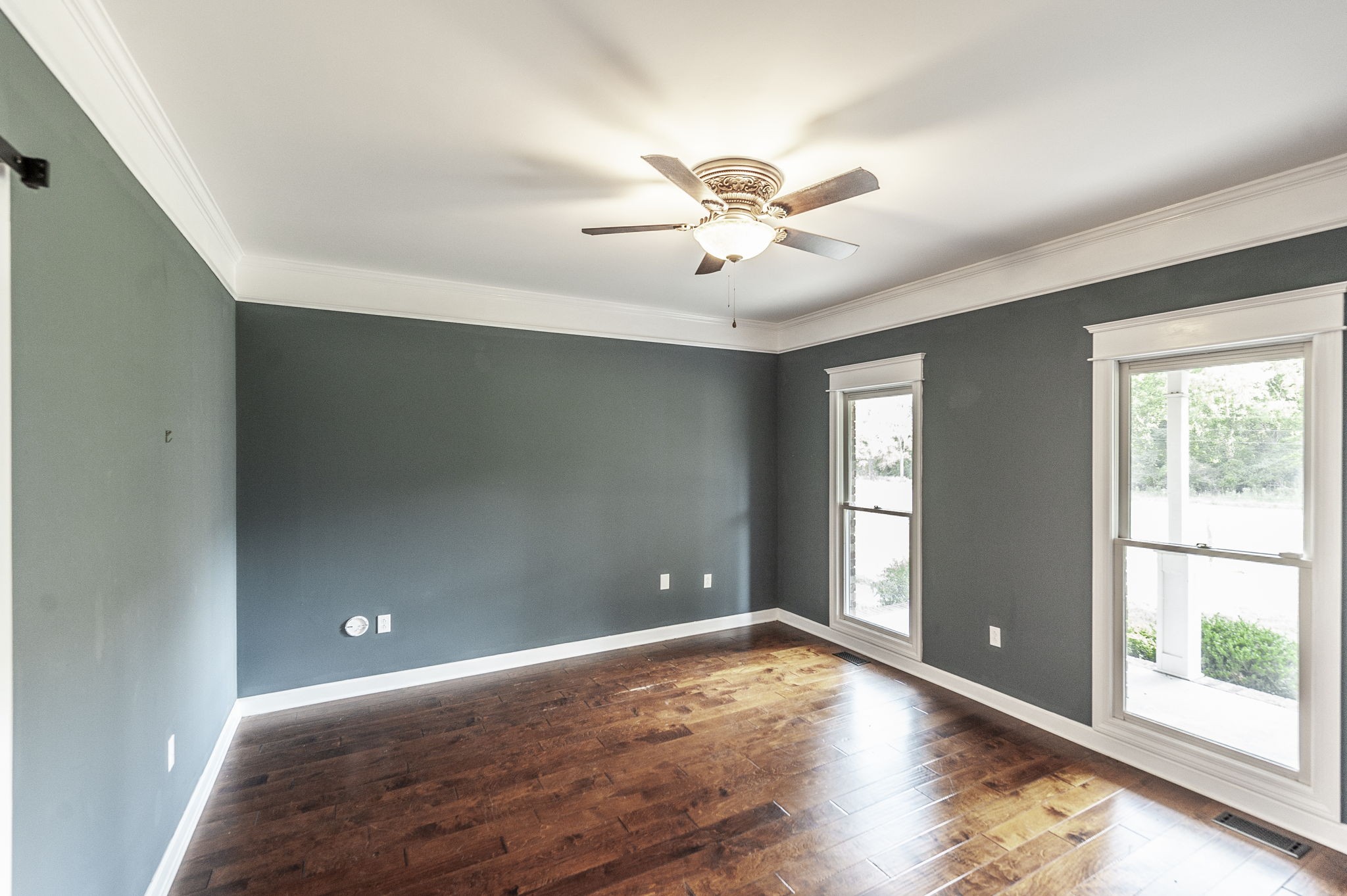 724 Deshea Creek Road Gallatin, TN 37066 - Photo 43 of 76 a view of a big room with wooden floor and windows