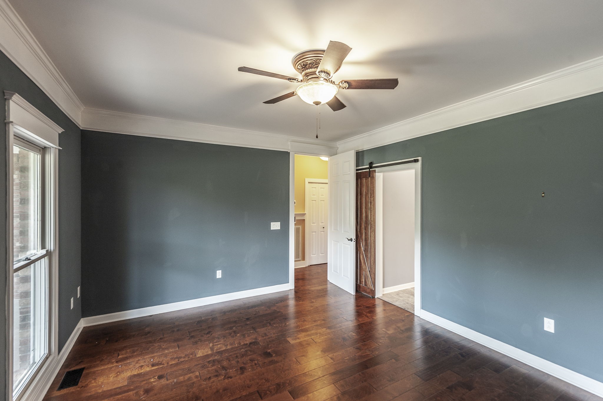 724 Deshea Creek Road Gallatin, TN 37066 - Photo 45 of 76 an empty room with wooden floor and windows