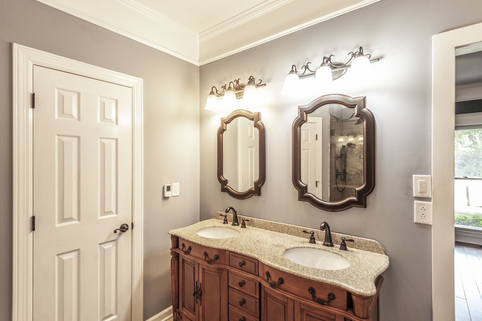 724 Deshea Creek Road Gallatin, TN 37066 - Photo 47 of 76 a bathroom with a double vanity sink and a mirror