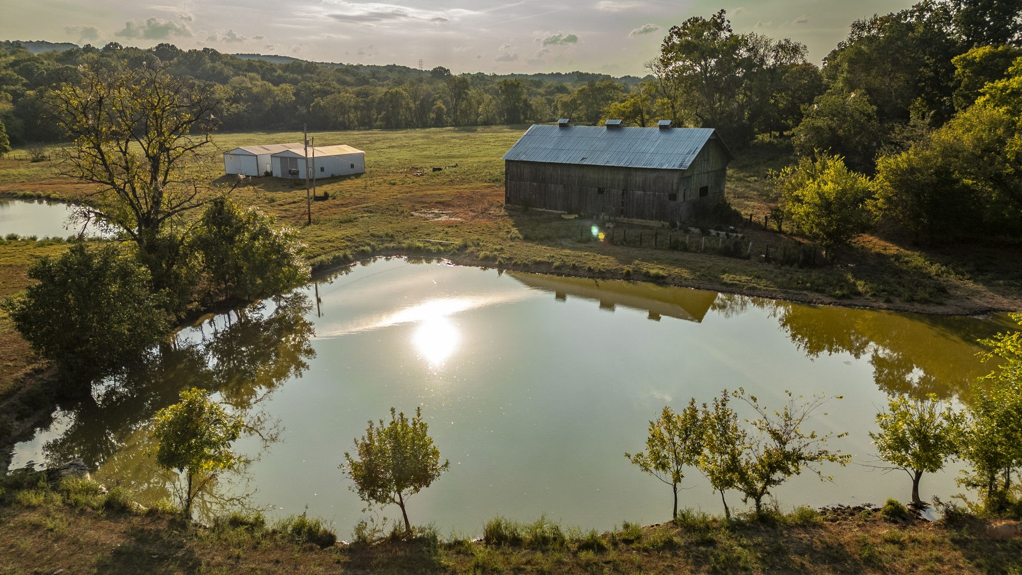 724 Deshea Creek Road Gallatin, TN 37066 - Photo 73 of 76 a view of a lake with a mountain in the background