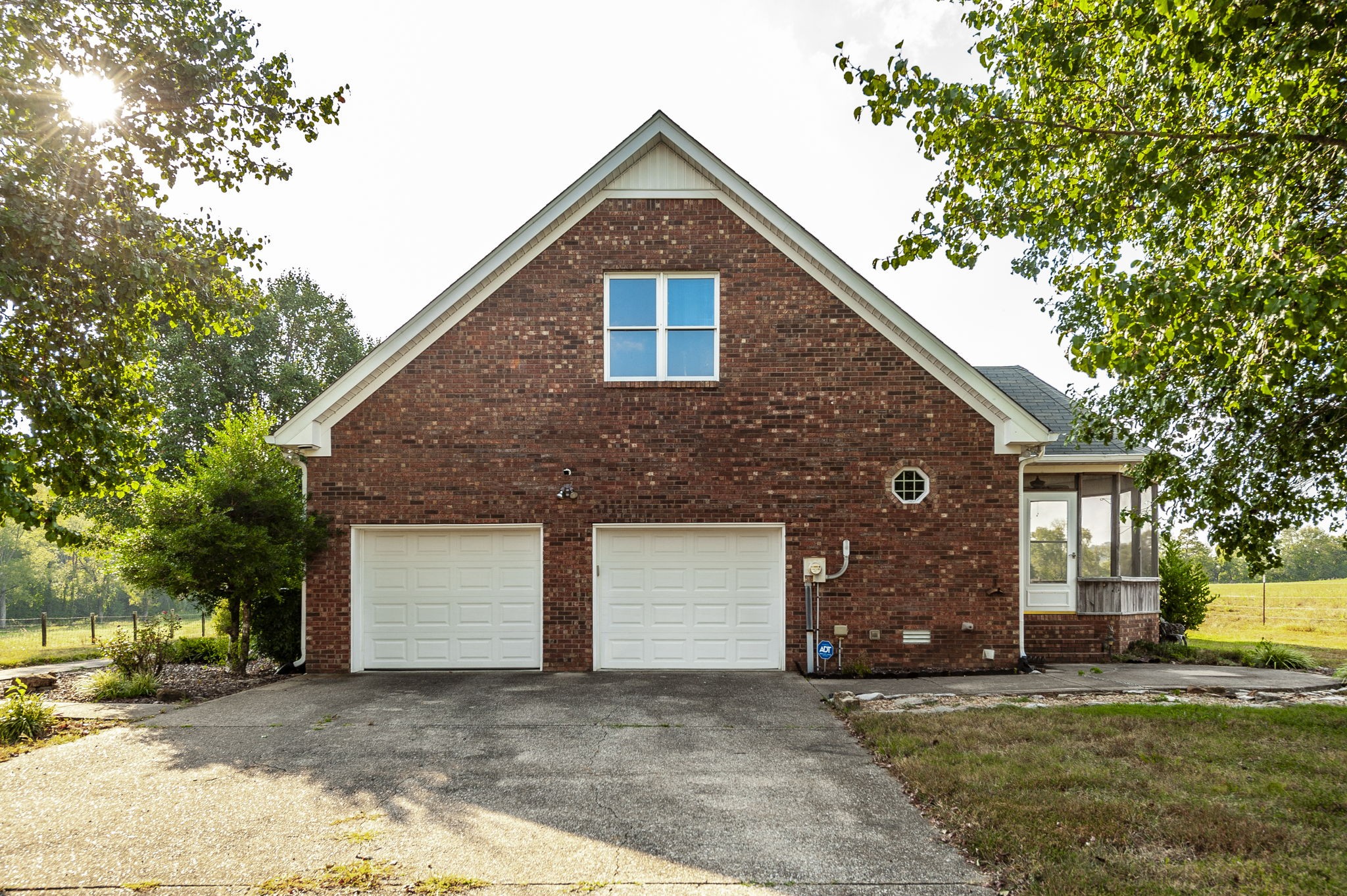 724 Deshea Creek Road Gallatin, TN 37066 - Photo 8 of 76 a front view of a house with a yard and garage