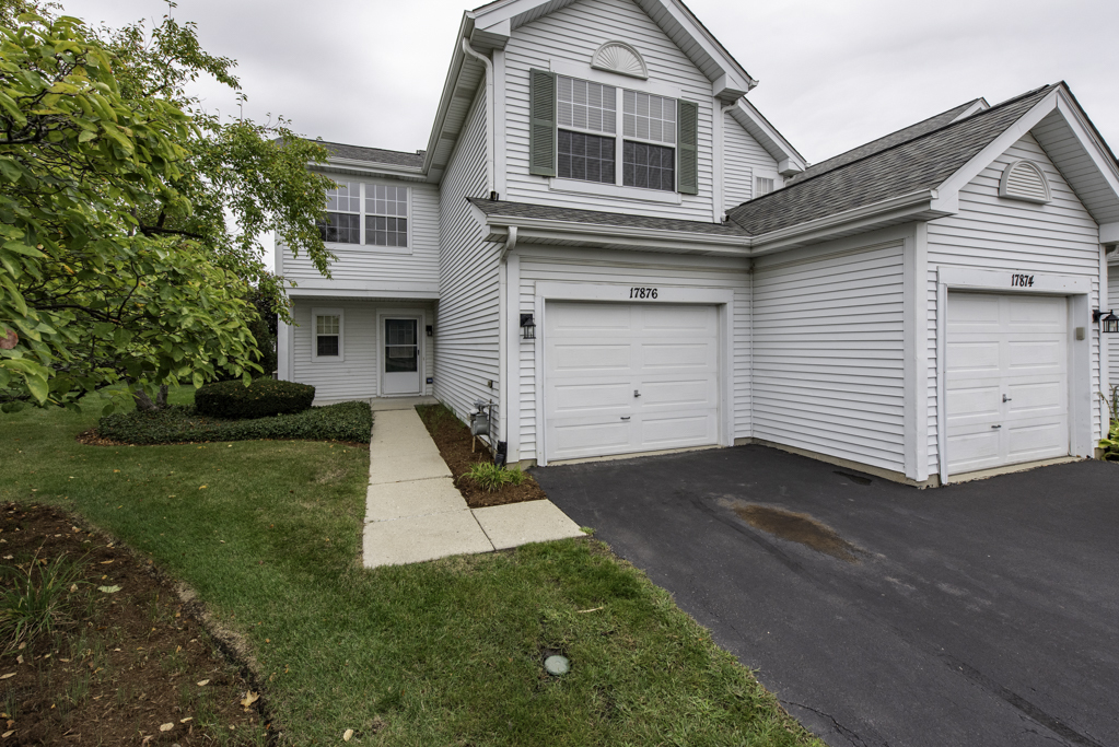 17876 Braewick Road Gurnee, IL 60031 - Photo 1 of 28 a front view of a house with a yard