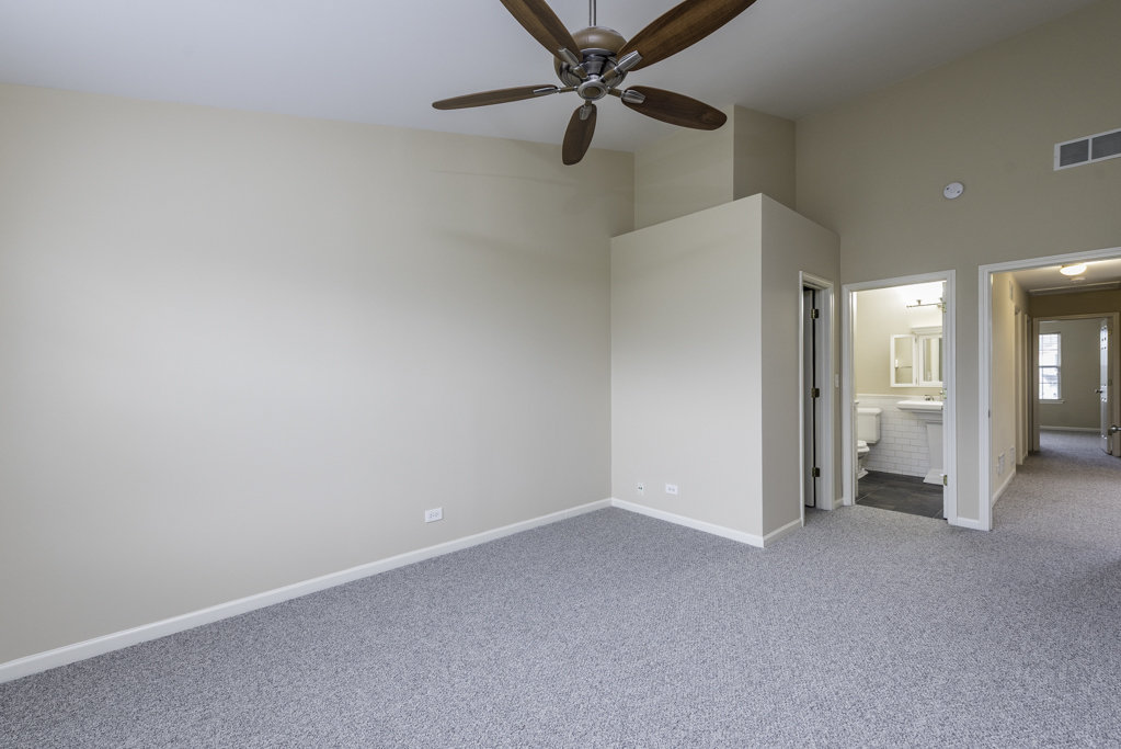 17876 Braewick Road Gurnee, IL 60031 - Photo 11 of 28 an empty room with a bathroom