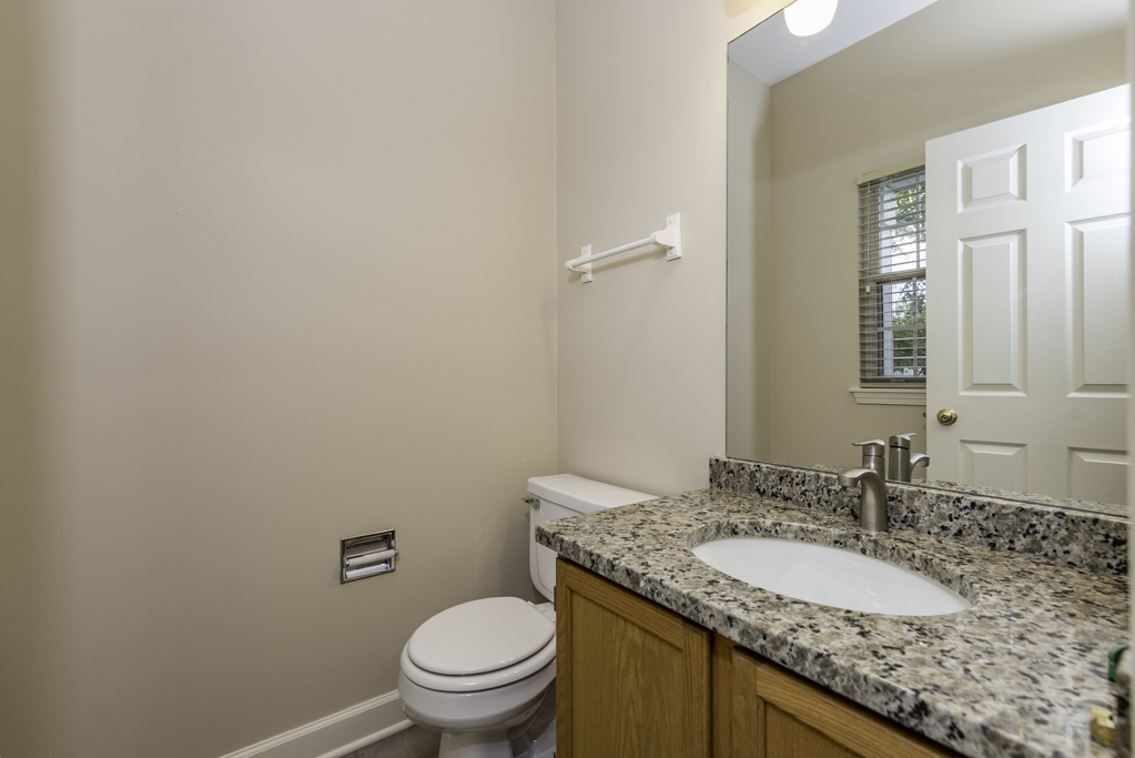 17876 Braewick Road Gurnee, IL 60031 - Photo 18 of 28 a bathroom with a granite countertop sink and a mirror