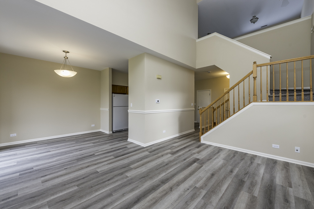 17876 Braewick Road Gurnee, IL 60031 - Photo 21 of 28 a view of a hallway with wooden floor
