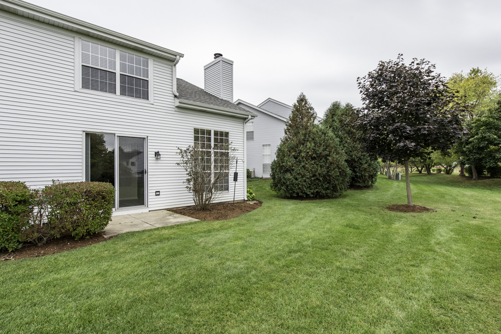 17876 Braewick Road Gurnee, IL 60031 - Photo 28 of 28 a view of a house with backyard and a tree