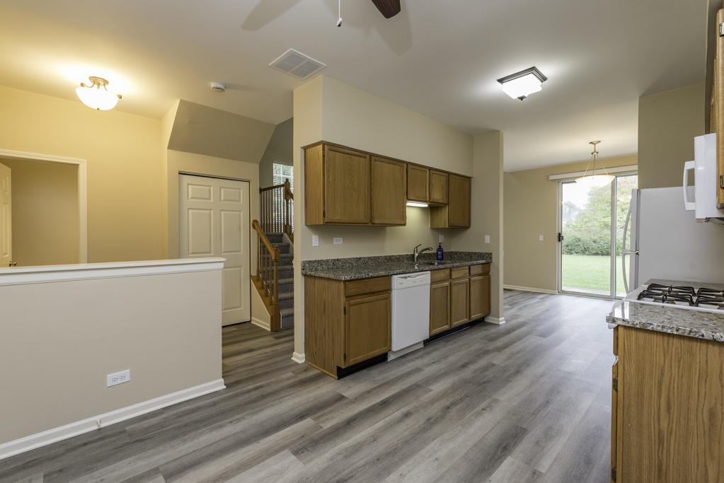 17876 Braewick Road Gurnee, IL 60031 - Photo 6 of 28 a kitchen with stainless steel appliances a refrigerator and a stove top oven