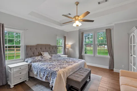 a bedroom with a large bed and a window