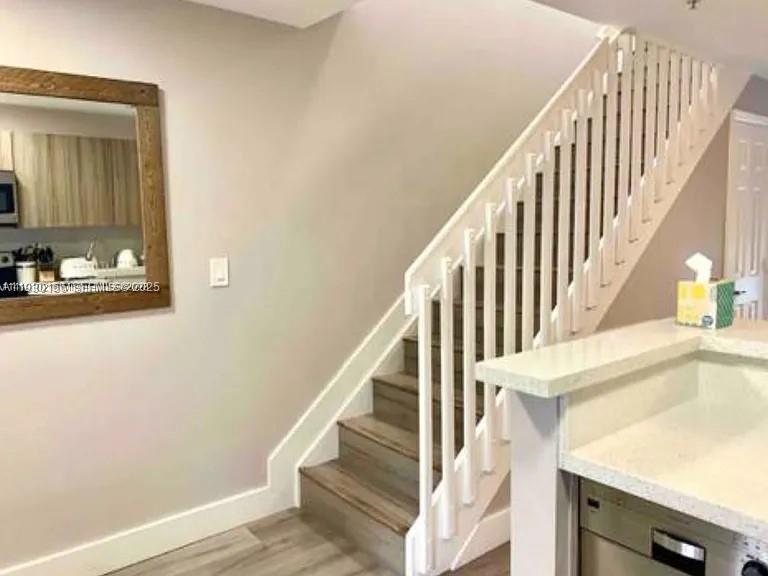 821 Southwest 2nd Street, Unit 2 Miami, FL 33130 - Photo 3 of 12 a view of entryway and hall with wooden floor