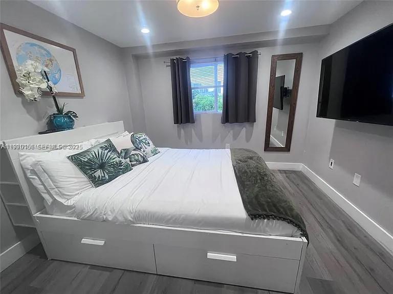 821 Southwest 2nd Street, Unit 2 Miami, FL 33130 - Photo 6 of 12 a living room with furniture and a flat screen tv