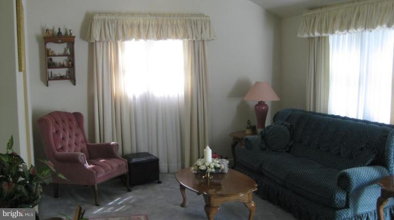 3109 Weller Road Silver Spring, MD 20906 - Photo 2 of 20 a living room with furniture and a window