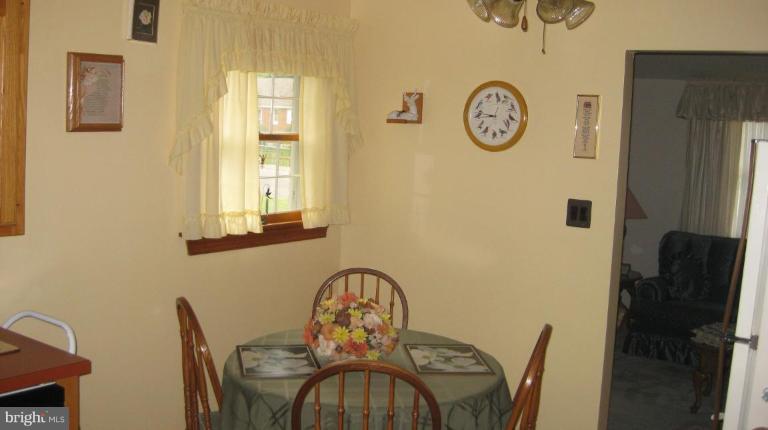3109 Weller Road Silver Spring, MD 20906 - Photo 15 of 20 a view of a door and chair in the livingroom