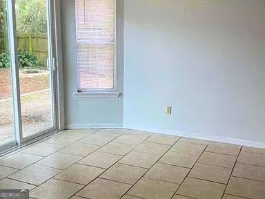 a view of an empty room and window