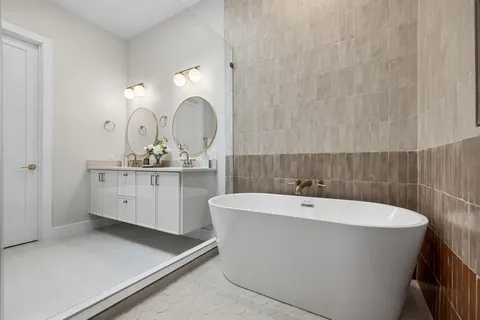 a white bath tub sitting in a bathroom