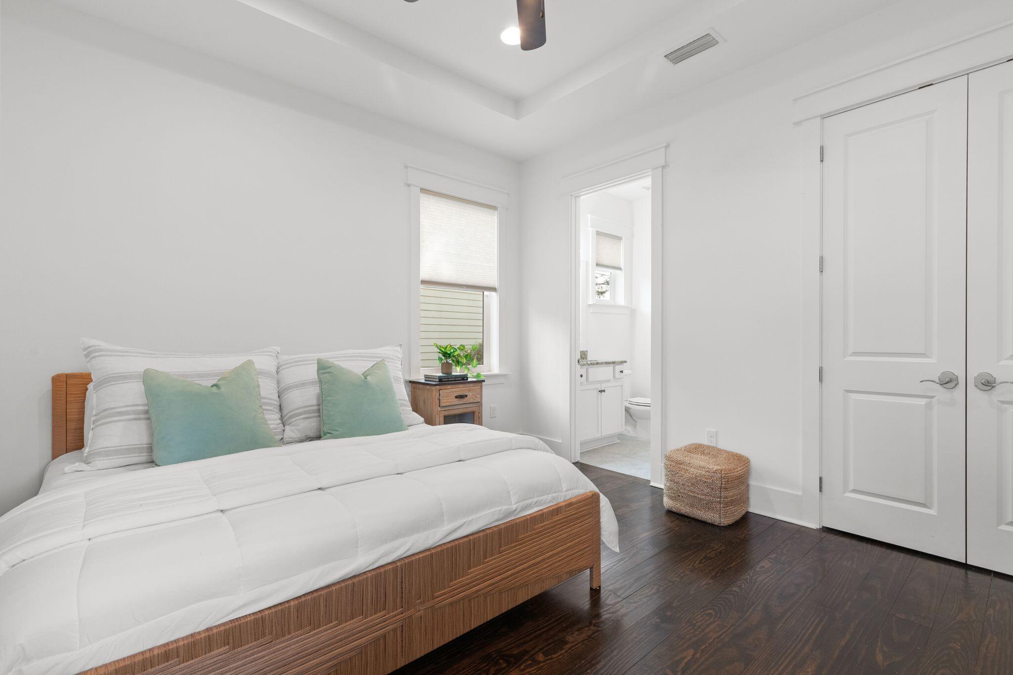 694 Flatwoods Forest Loop Santa Rosa Beach, FL 32459 - Photo 13 of 54 a bedroom with a bed and a table