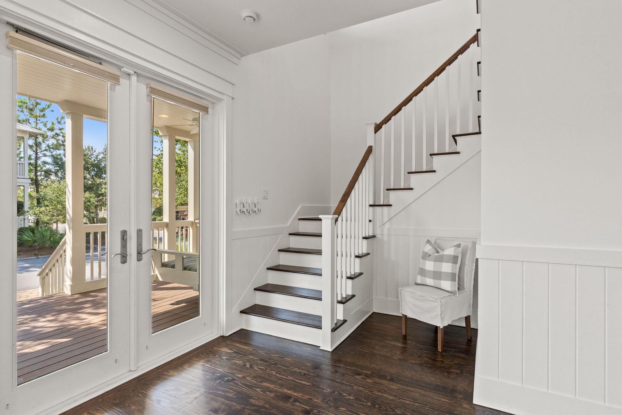 694 Flatwoods Forest Loop Santa Rosa Beach, FL 32459 - Photo 15 of 54 a view of entryway with wooden floor and stairs