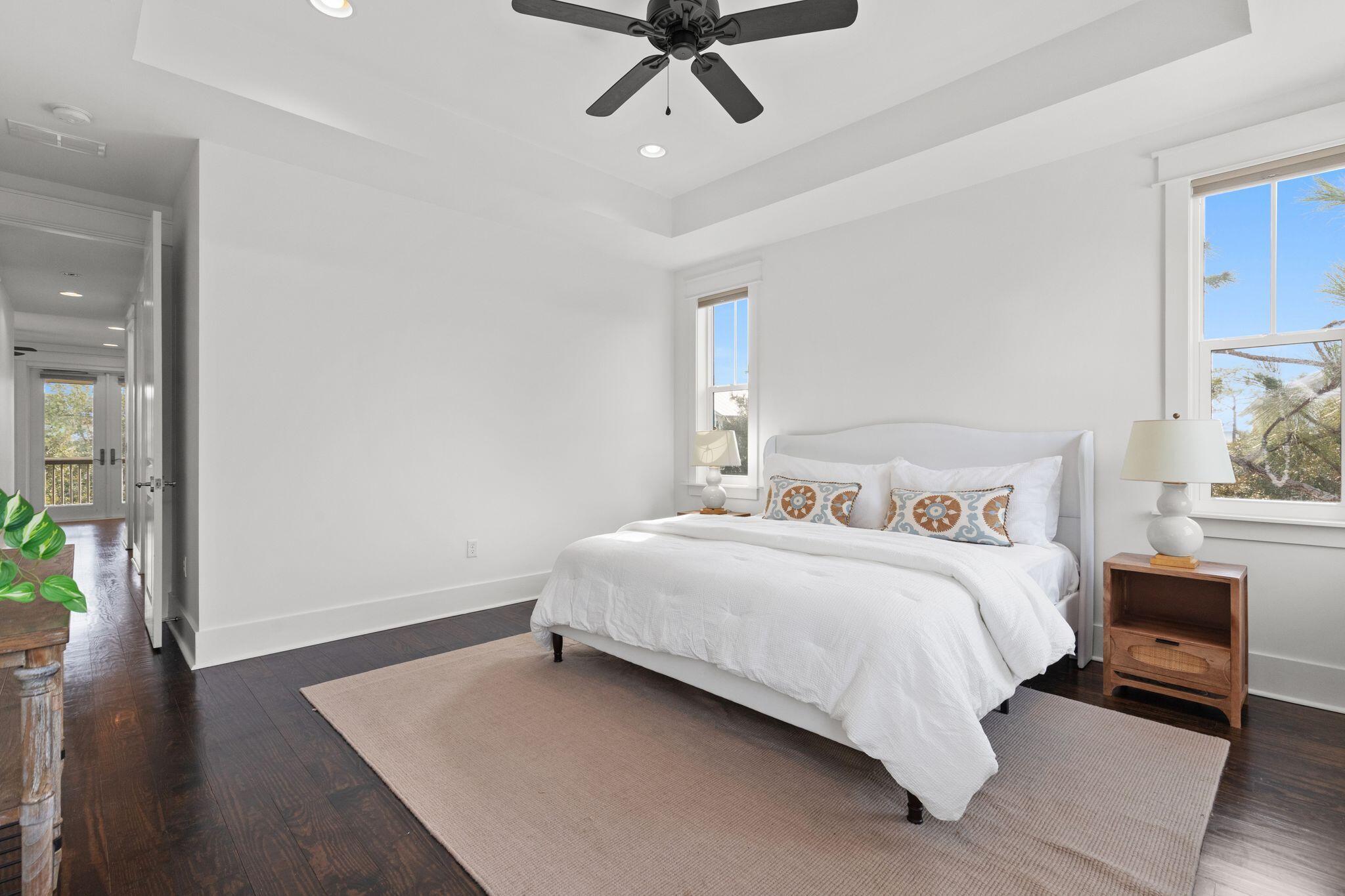 694 Flatwoods Forest Loop Santa Rosa Beach, FL 32459 - Photo 20 of 54 a bedroom with a bed and wooden floor