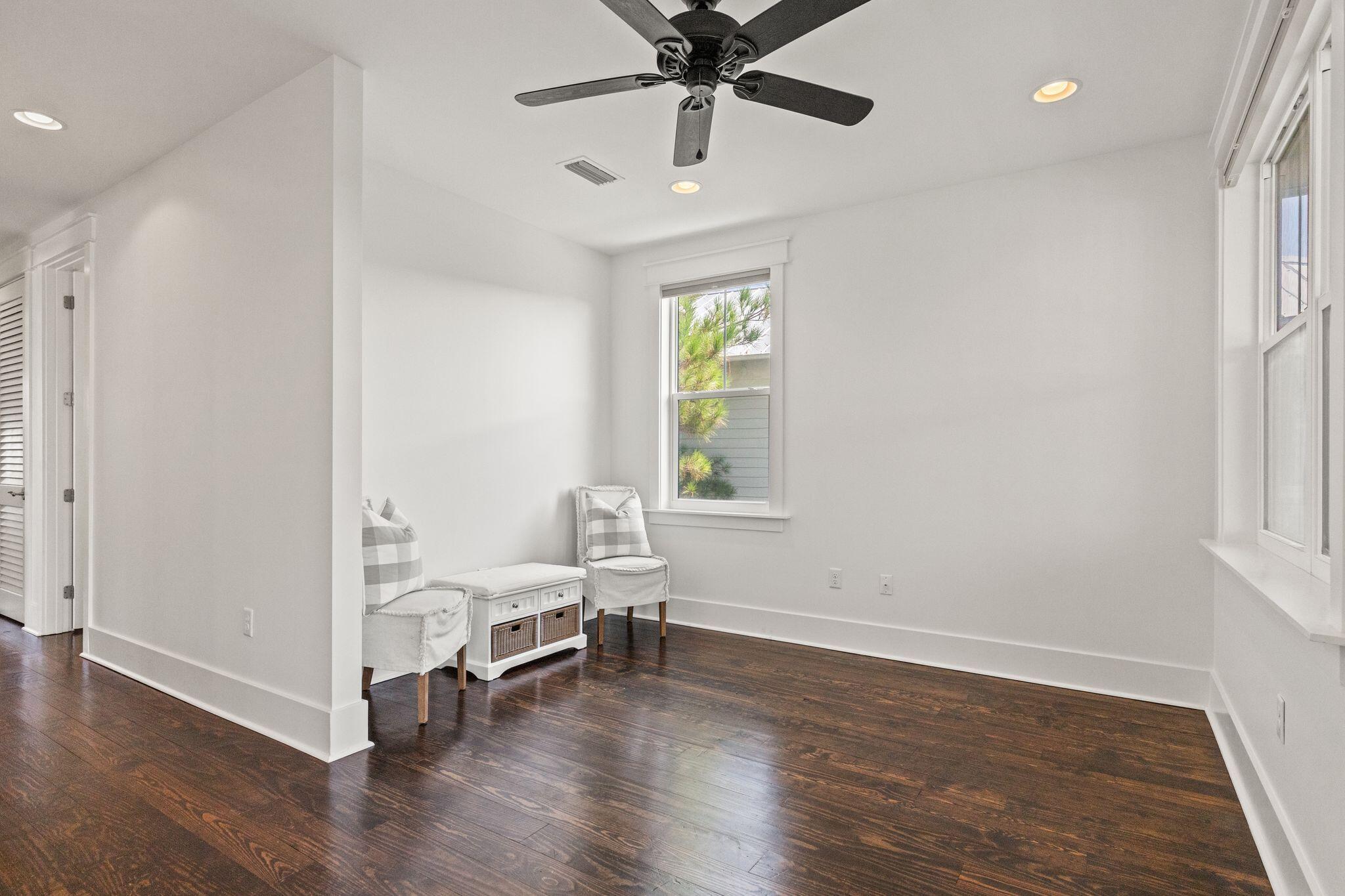 694 Flatwoods Forest Loop Santa Rosa Beach, FL 32459 - Photo 25 of 54 a view of an empty room with window and wooden floor