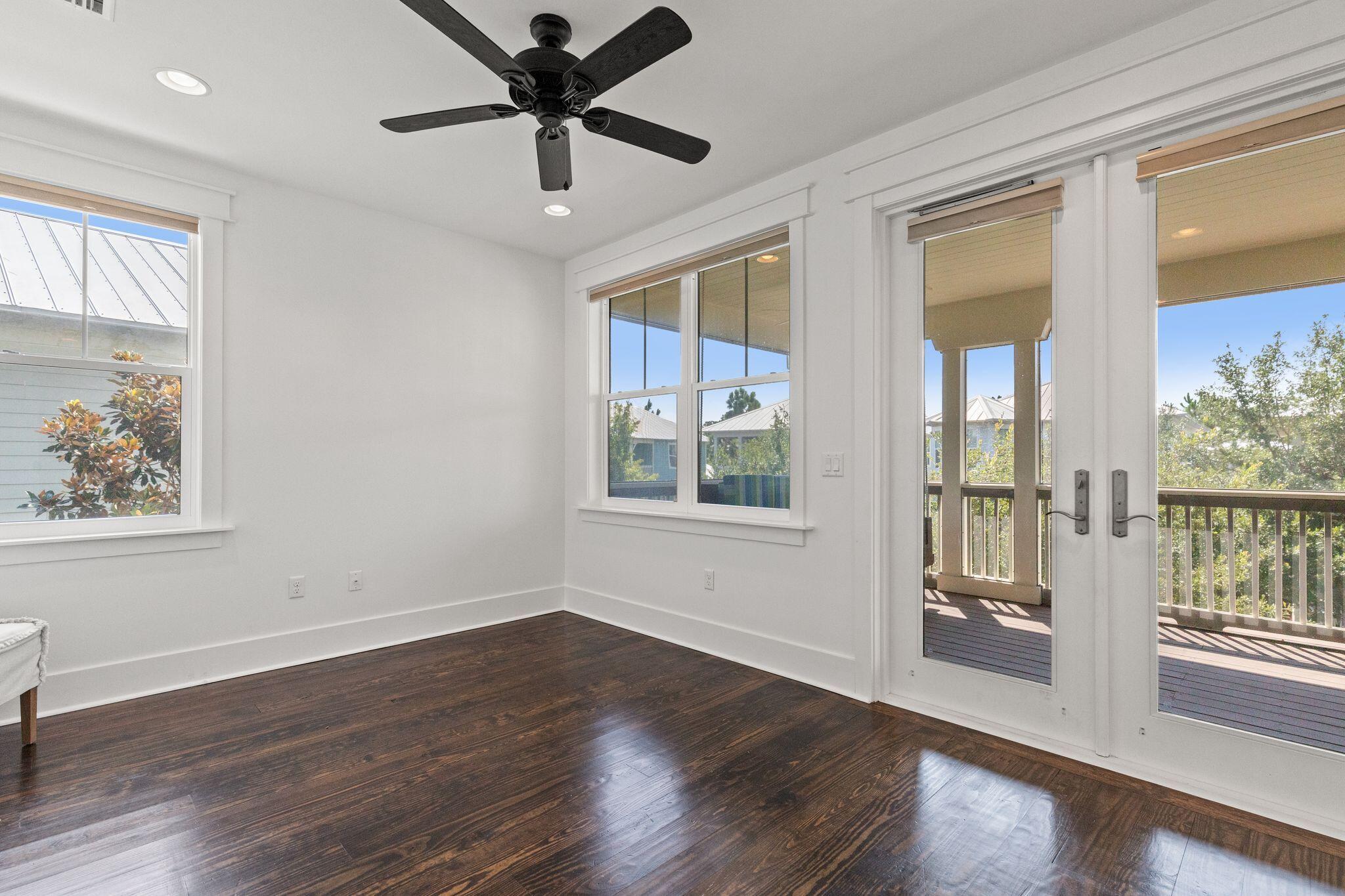 694 Flatwoods Forest Loop Santa Rosa Beach, FL 32459 - Photo 27 of 54 a view of an empty room with a window and wooden floor