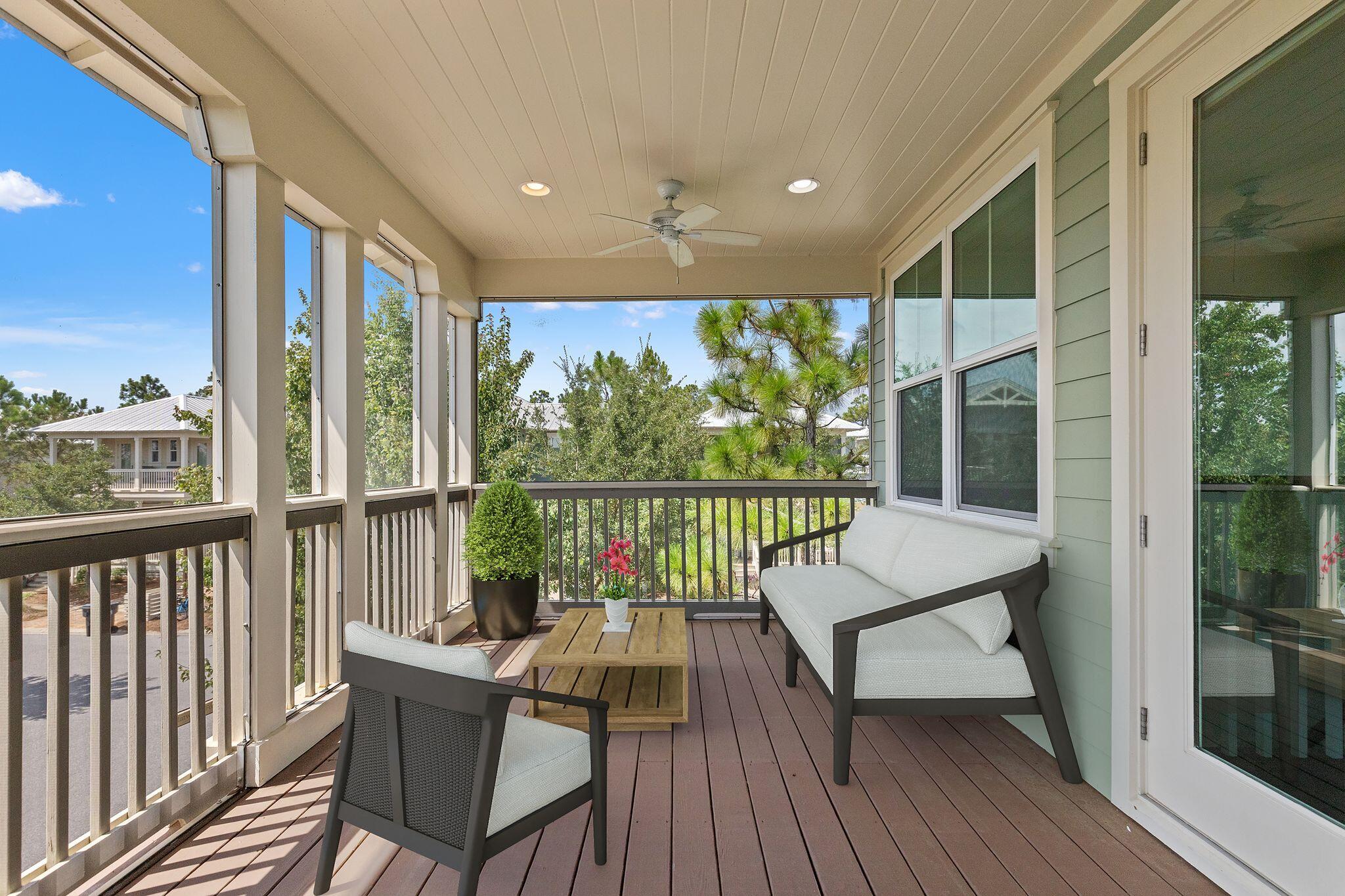 694 Flatwoods Forest Loop Santa Rosa Beach, FL 32459 - Photo 29 of 54 a view of a balcony with wooden floor and outdoor seating