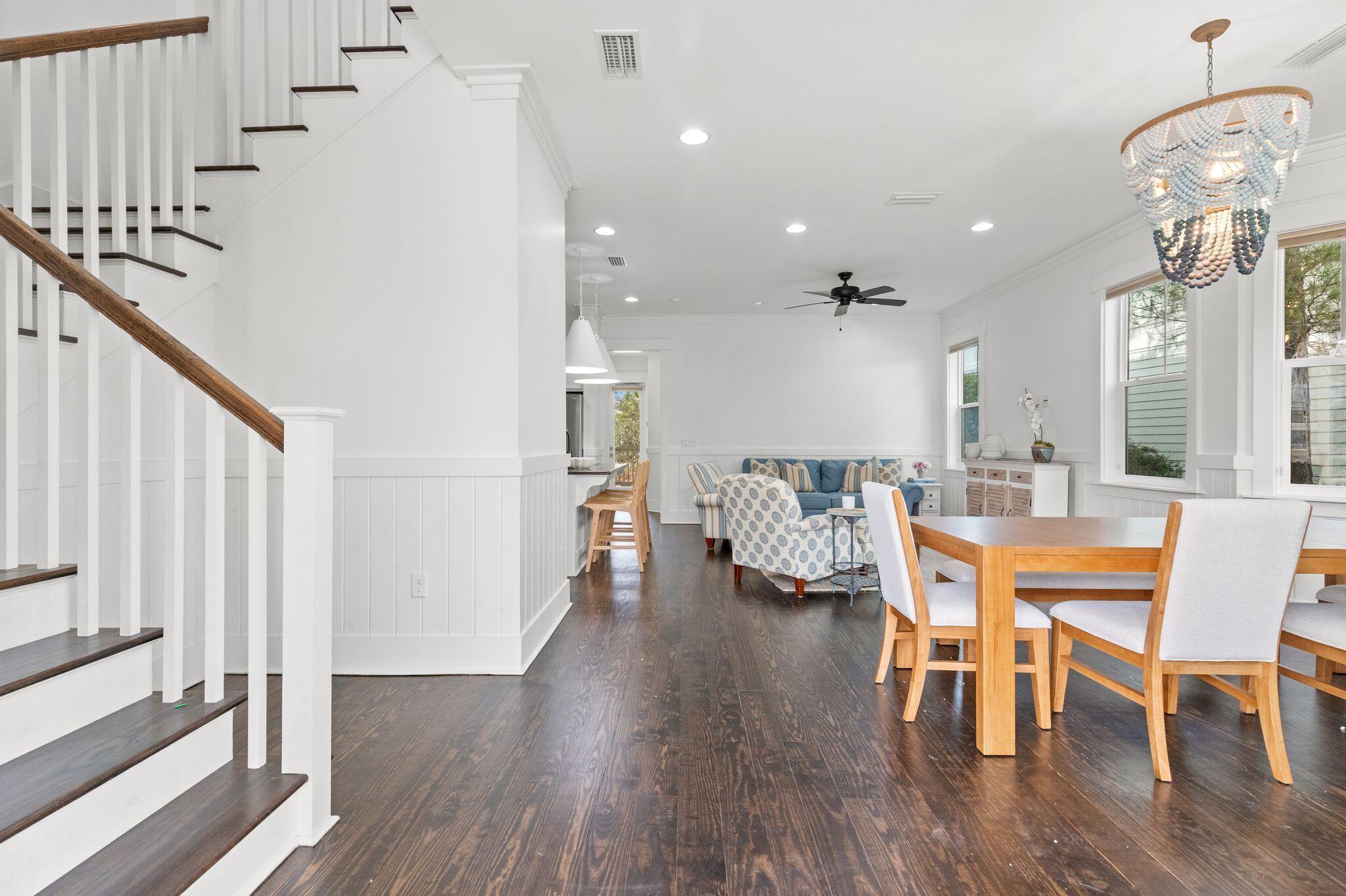 694 Flatwoods Forest Loop Santa Rosa Beach, FL 32459 - Photo 3 of 54 a dining room with furniture and wooden floor