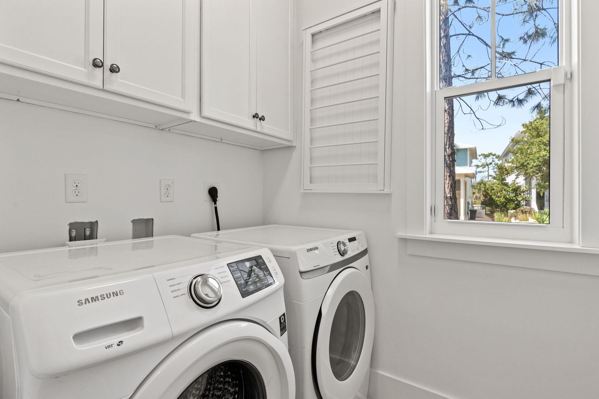 694 Flatwoods Forest Loop Santa Rosa Beach, FL 32459 - Photo 34 of 54 a utility room with dryer and washer