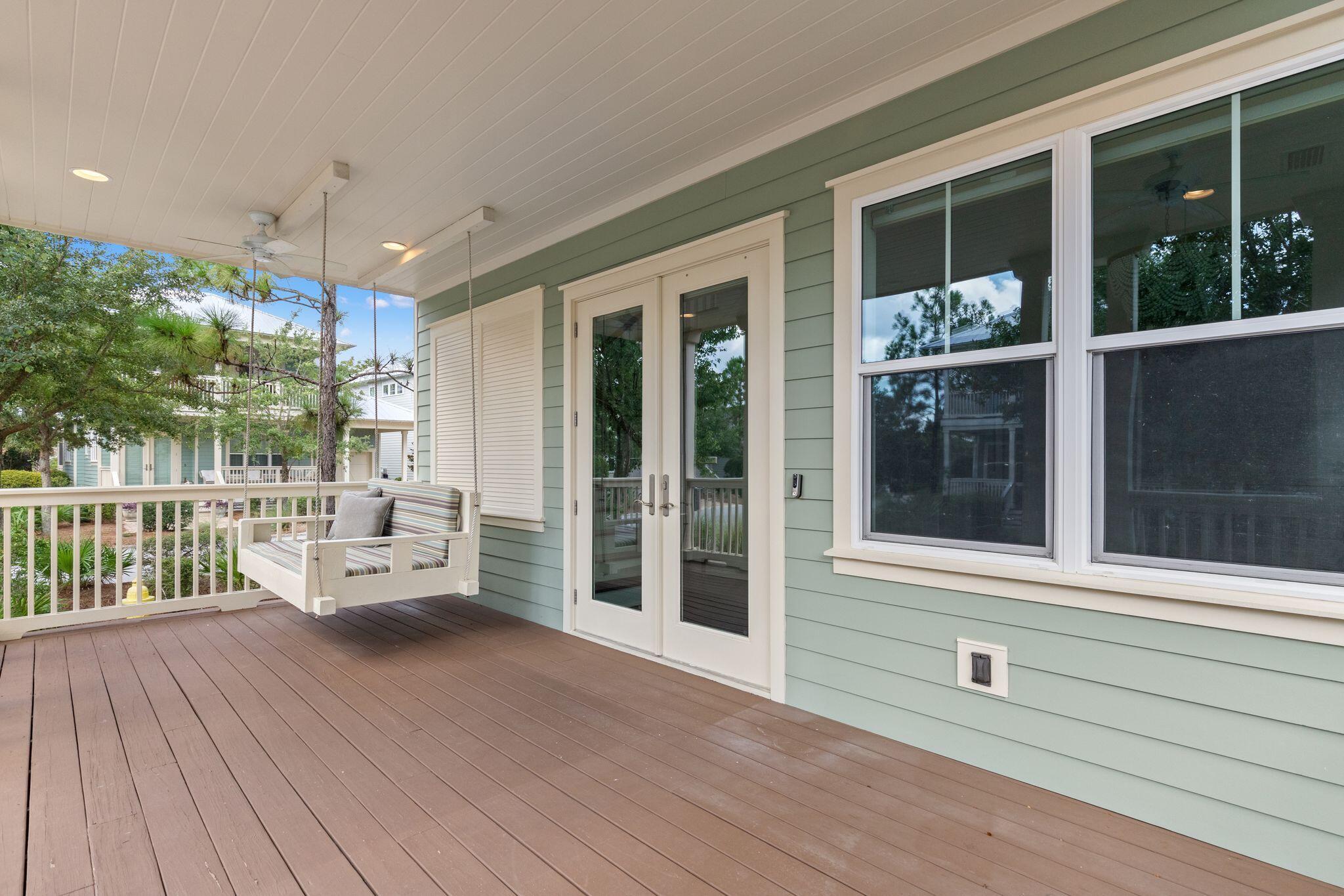 694 Flatwoods Forest Loop Santa Rosa Beach, FL 32459 - Photo 42 of 54 a living room with furniture and a large window