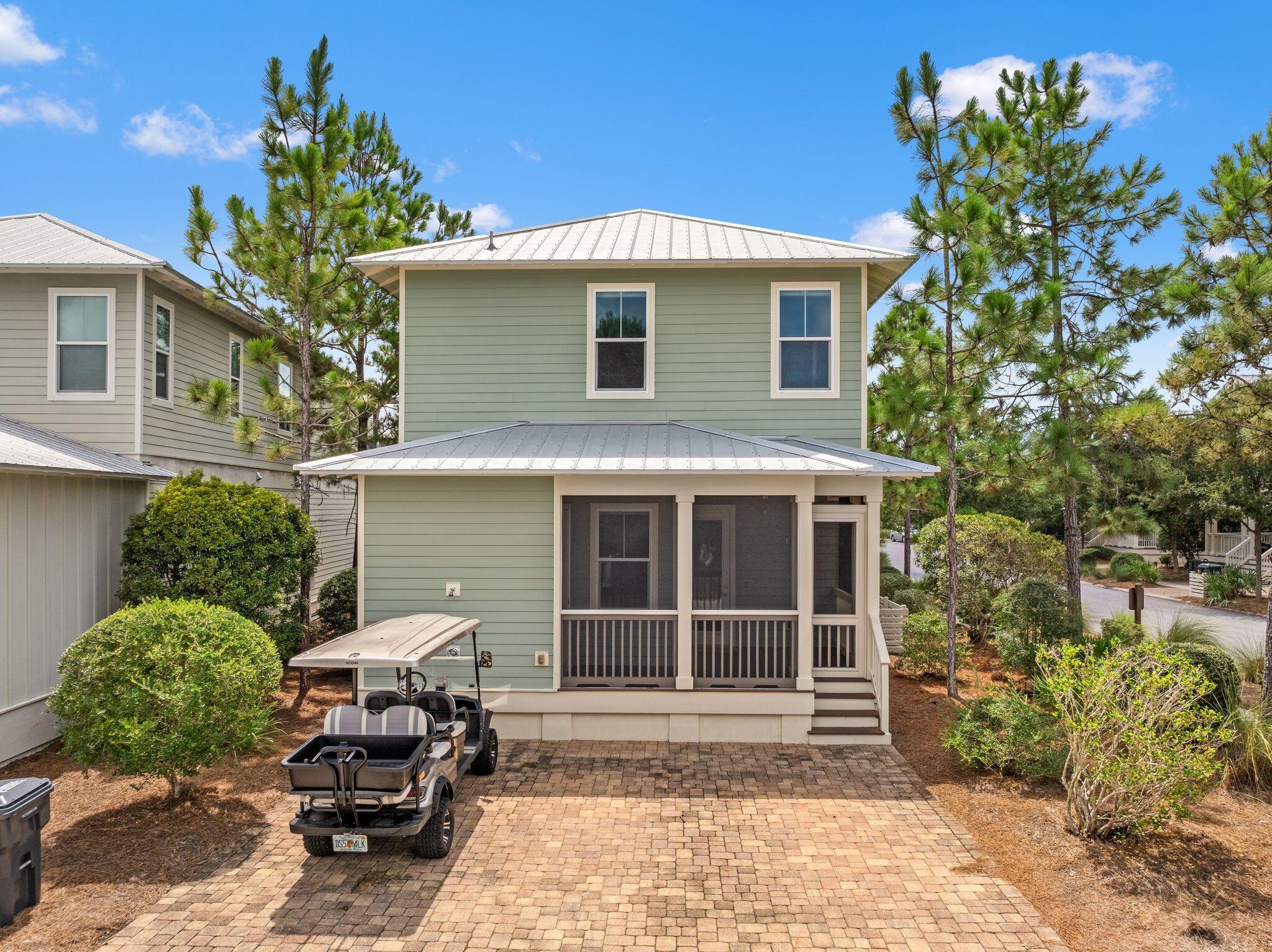 694 Flatwoods Forest Loop Santa Rosa Beach, FL 32459 - Photo 45 of 54 a house view with a sitting space and garden space