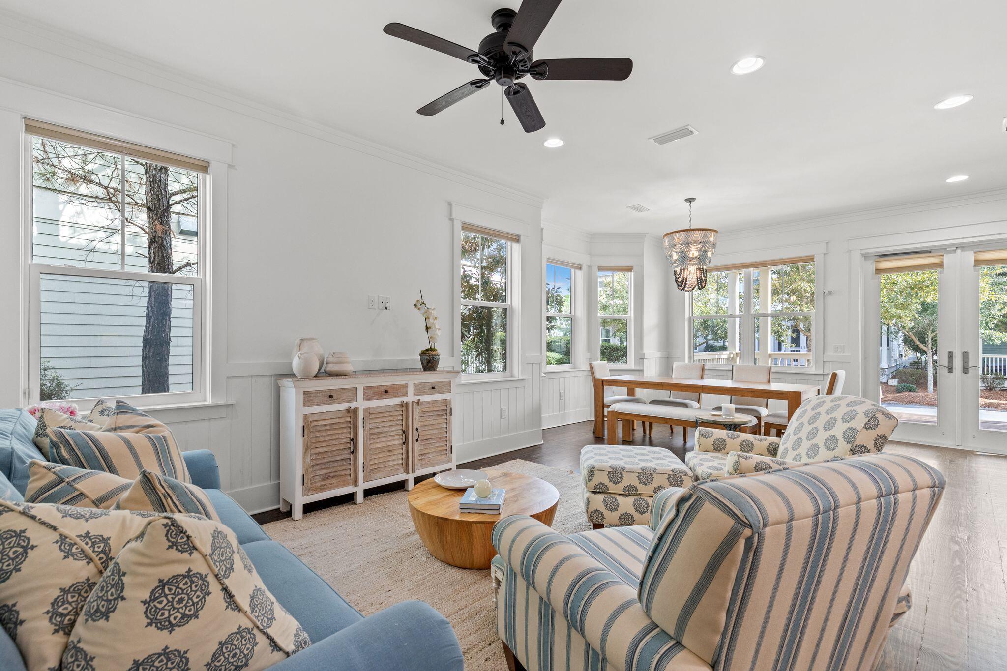 694 Flatwoods Forest Loop Santa Rosa Beach, FL 32459 - Photo 8 of 54 a bedroom with a bed and a chandelier