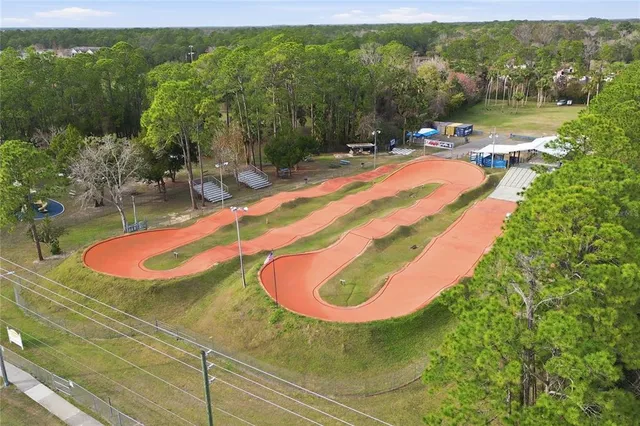 a view of a house with swimming pool and porch