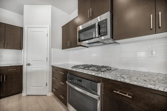 a kitchen with granite countertop a sink and a granite counter tops