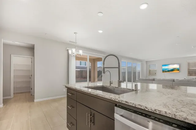 a view of a kitchen with a sink and dishwasher kitchen view