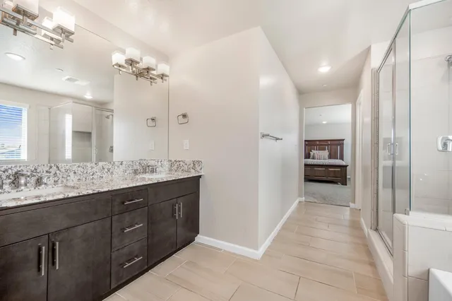a bathroom with a bathtub and a shower