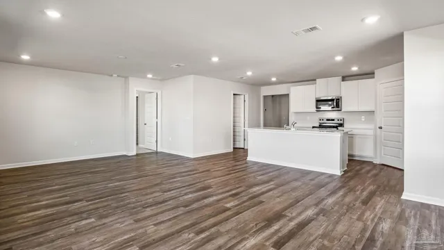 a view of kitchen with wooden floor